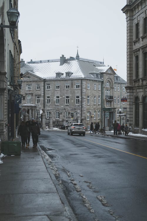 Kostnadsfri bild av byggnader, gata, snö