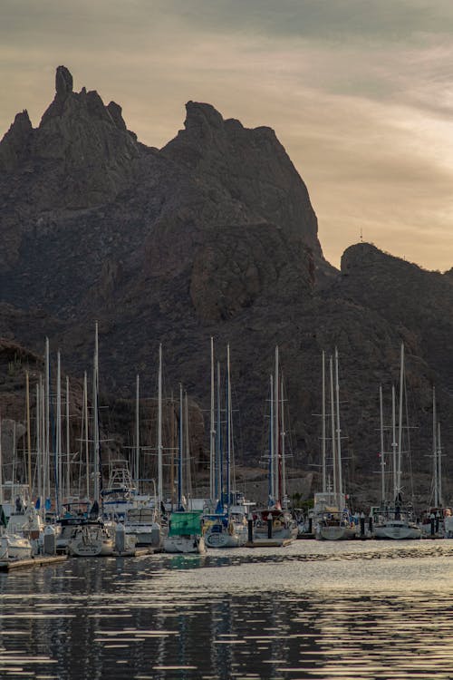 Rock Formation over Yachts on Sea Shore