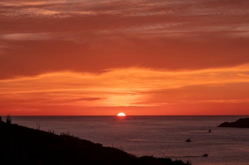 The Sun Setting Over a Sea 