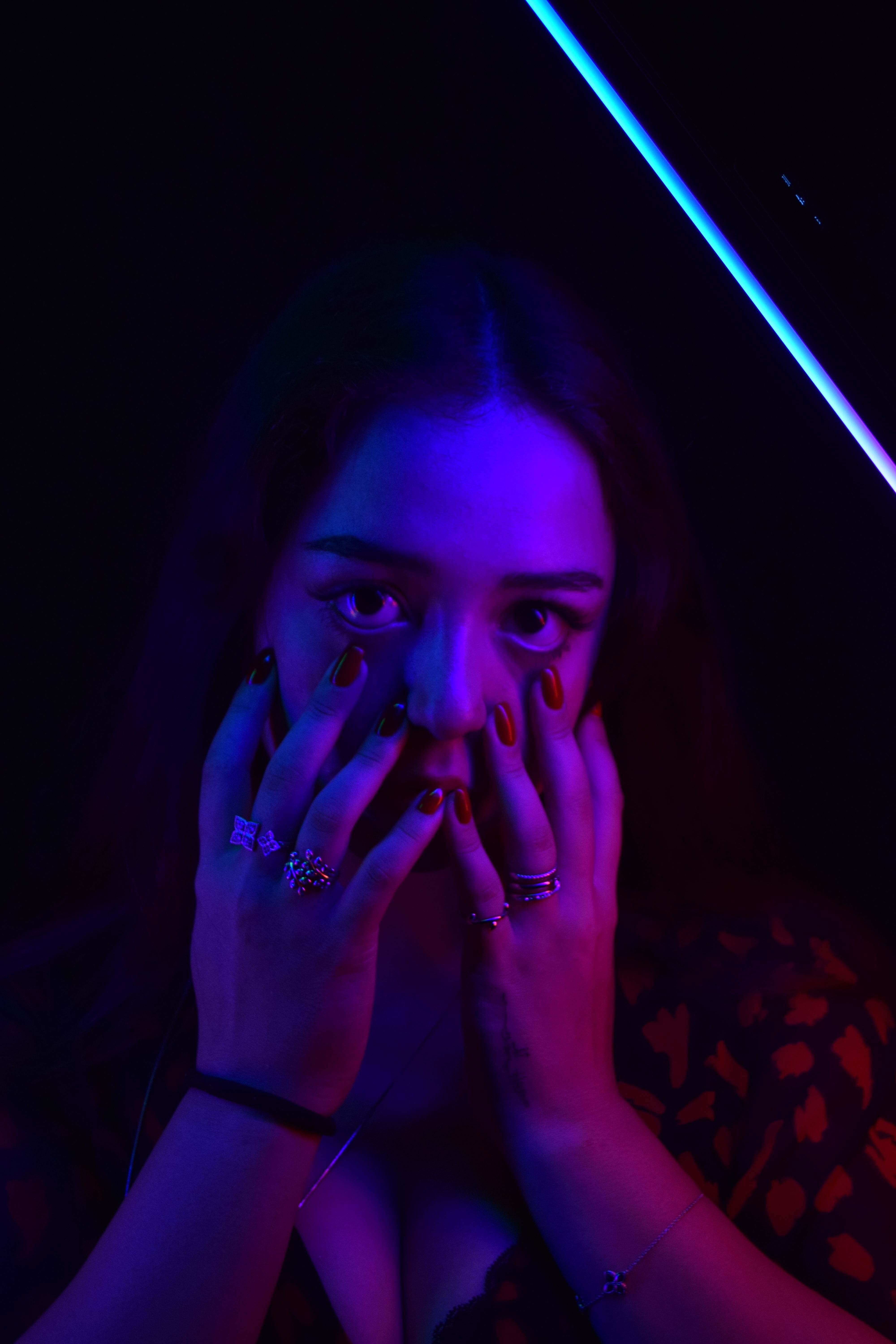 Portrait of a Woman in a Dark Room · Free Stock Photo