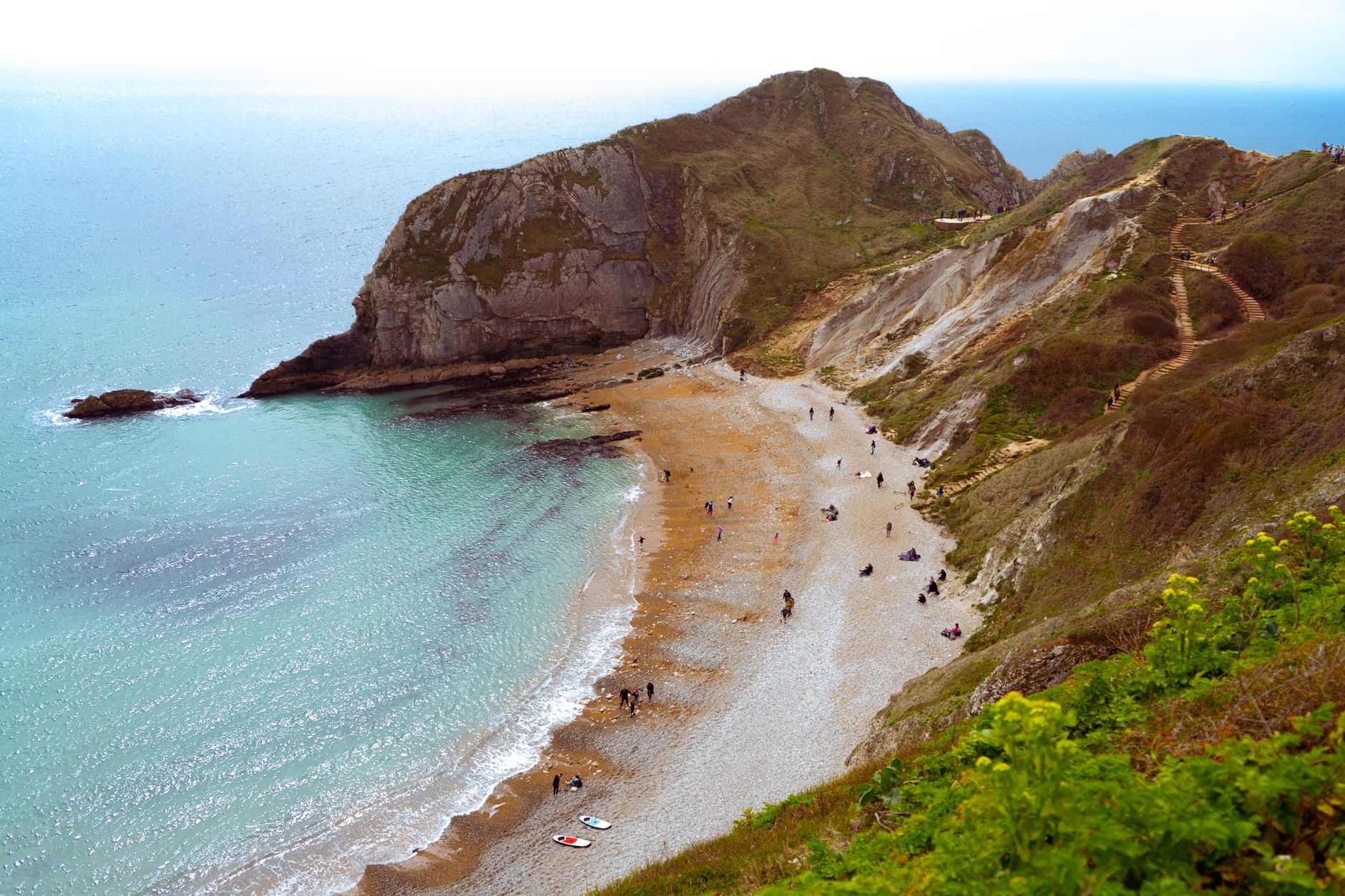 Explore the breathtaking cliffs and turquoise sea at Man O' War Beach, Dorset.