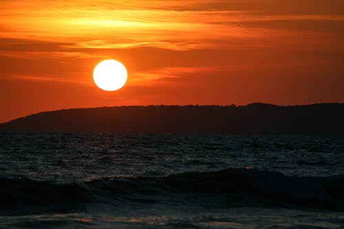 Sun over Sea Shore at Sunset