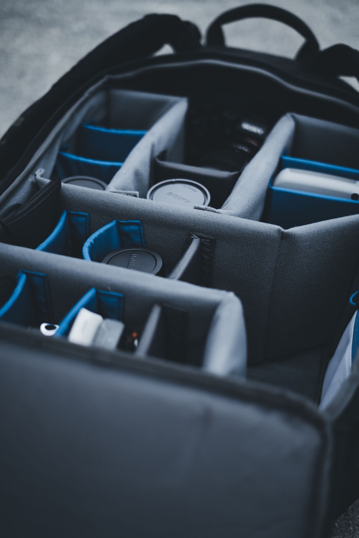 Close-up of a padded backpack compartment designed to separate and cushion electronic equipment