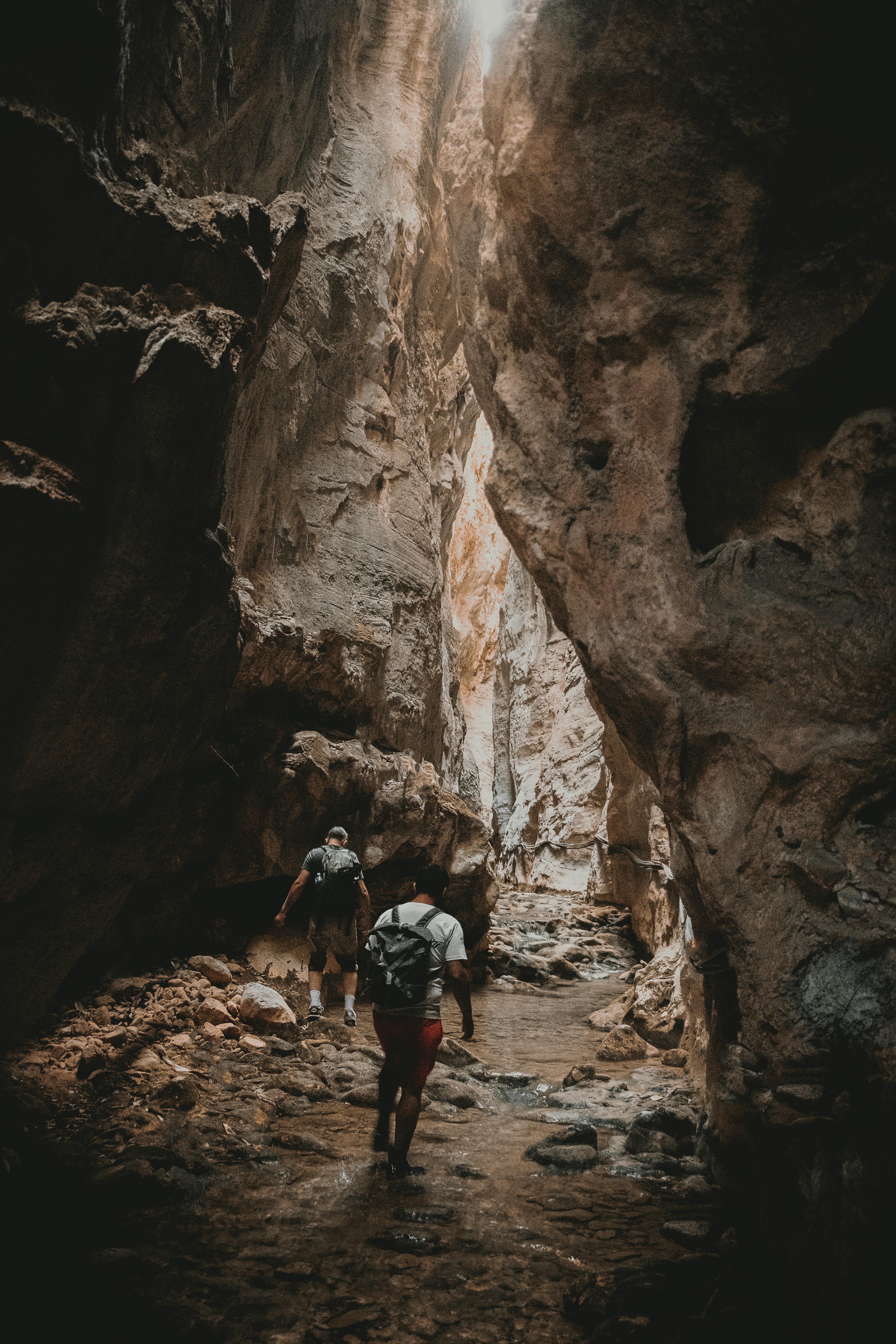 Adventurers hike through a stunning gorge in Mexico, showcasing nature's rugged beauty.