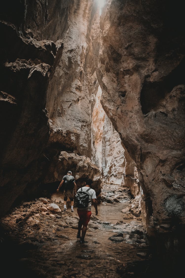 Scenic Photo Of Two Men In A Cave