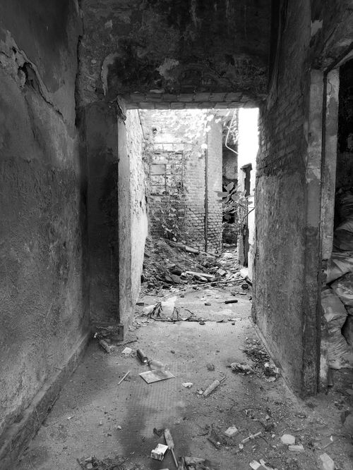 Free Black and white image of a decaying and derelict building interior. Stock Photo
