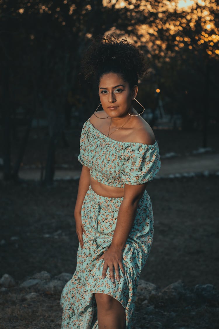 Young Woman In A Summer Outfit Standing Outdoors 