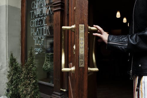 Person Holding Door Lever