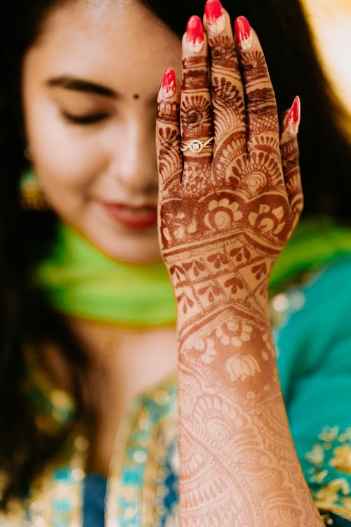 Woman Showing Traditional Drawing on Hand