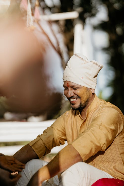 Bridegroom Smiling during a Traditional Indian Wedding Custom 