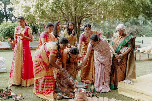 Bride and Wedding Guests during a Traditional Ritual at an Indian Wedding 