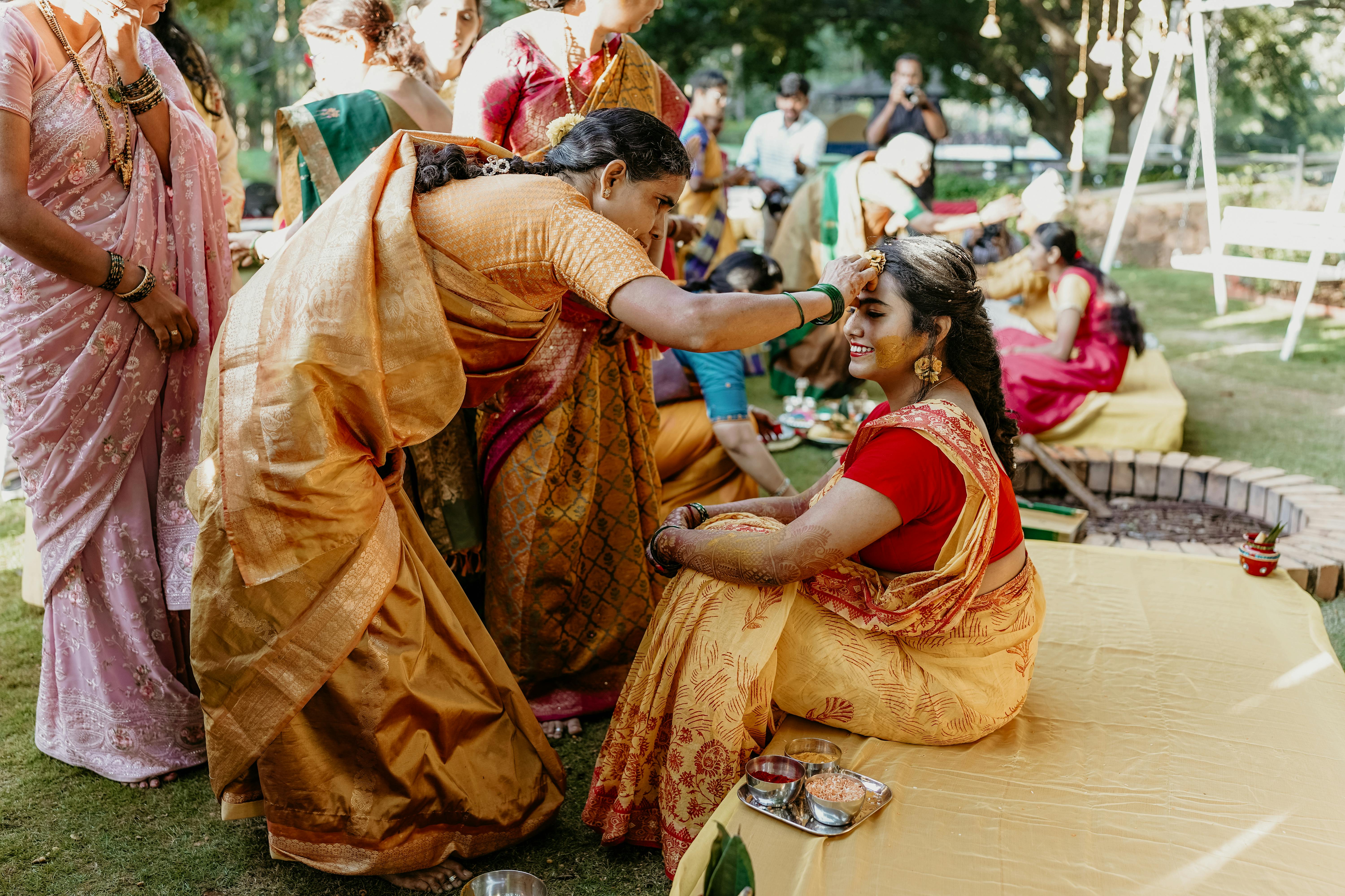 free photo of bride during a traditional ritual at an indian wedding