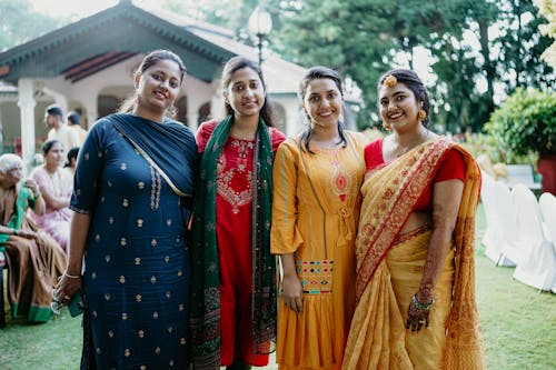 Wedding Guests Posing with the Bride at the Wedding 