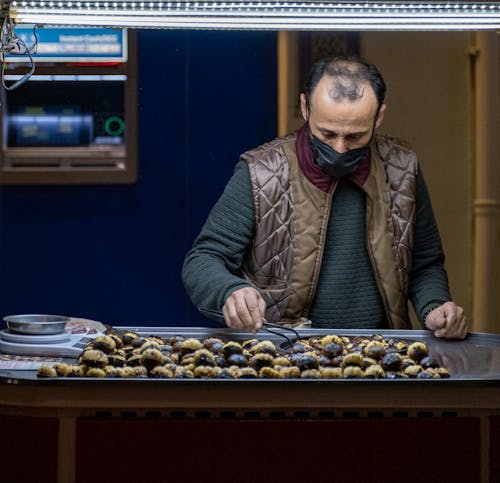 Seller of Pastry with Face Mask