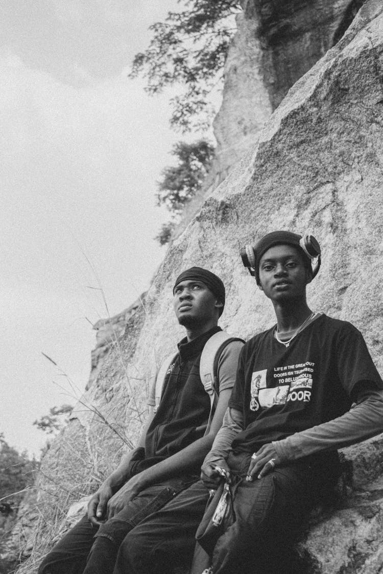 Men Posing Under Rock