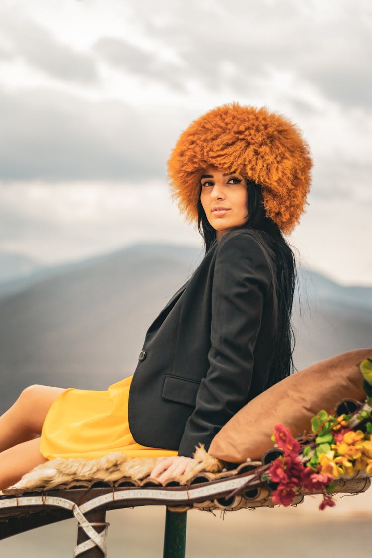 Photo Of A Model Wearing A Yellow Skirt And A Hairy Hat