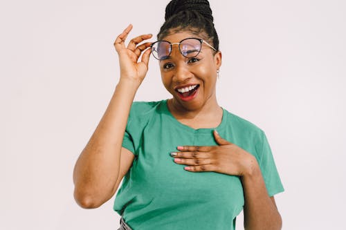 Woman Raising Her Glasses in an Expression of Astonishment