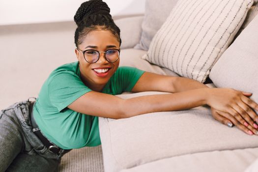 Smiling Woman Leaning on Couch