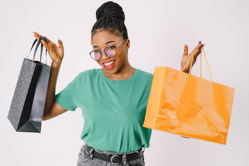 Happy Woman Shows Her Shopping Bags