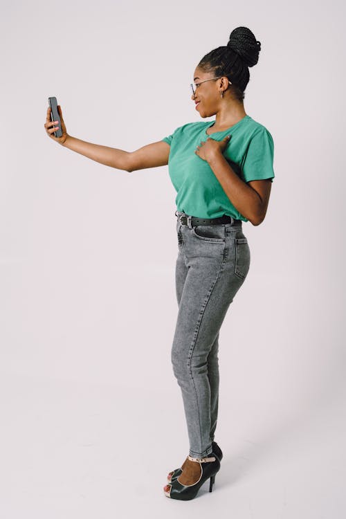 Smiling Woman Taking Selfie on Cellphone