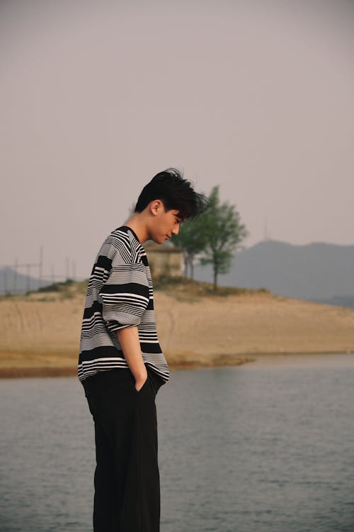 Teenage Boy by the Water