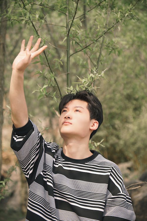 Teenage Boy with Raised Hand