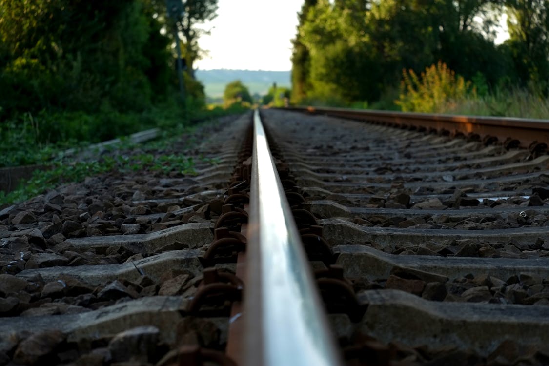 Free Brown Train Rail on Close Up Photo during Daytime Stock Photo