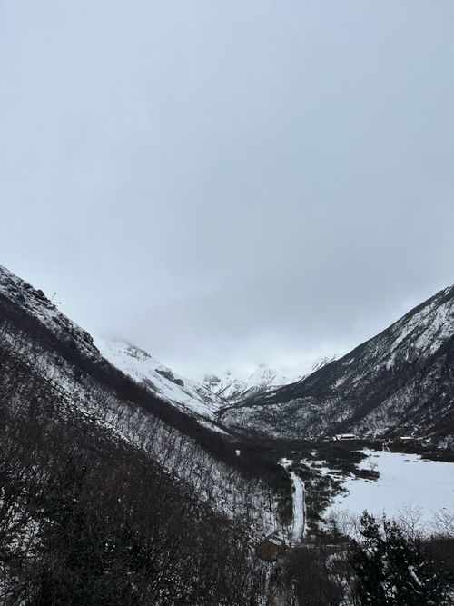 Free A scenic winter landscape with snow-capped mountains in Sichuan, China. Stock Photo