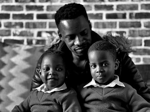 Father Posing with Children in Black and White