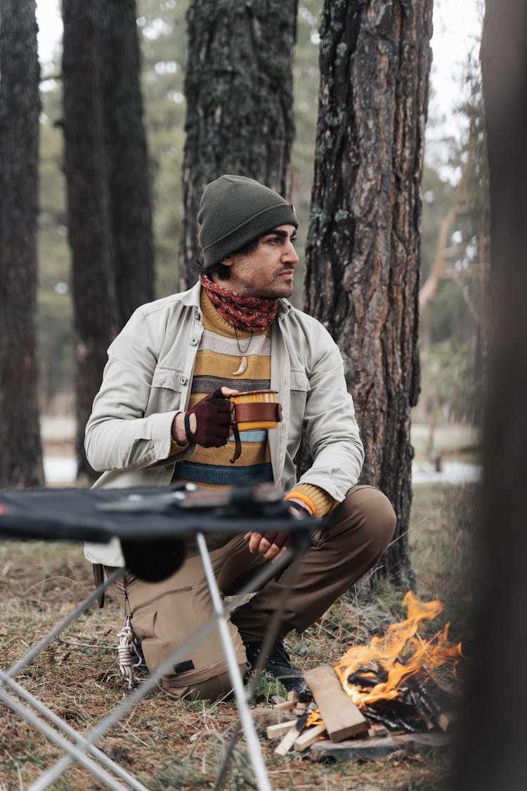 Man Drinking Coffee In Camp