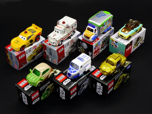 Free Vibrant display of die-cast toy cars from popular franchises like Star Wars and Disney. Stock Photo