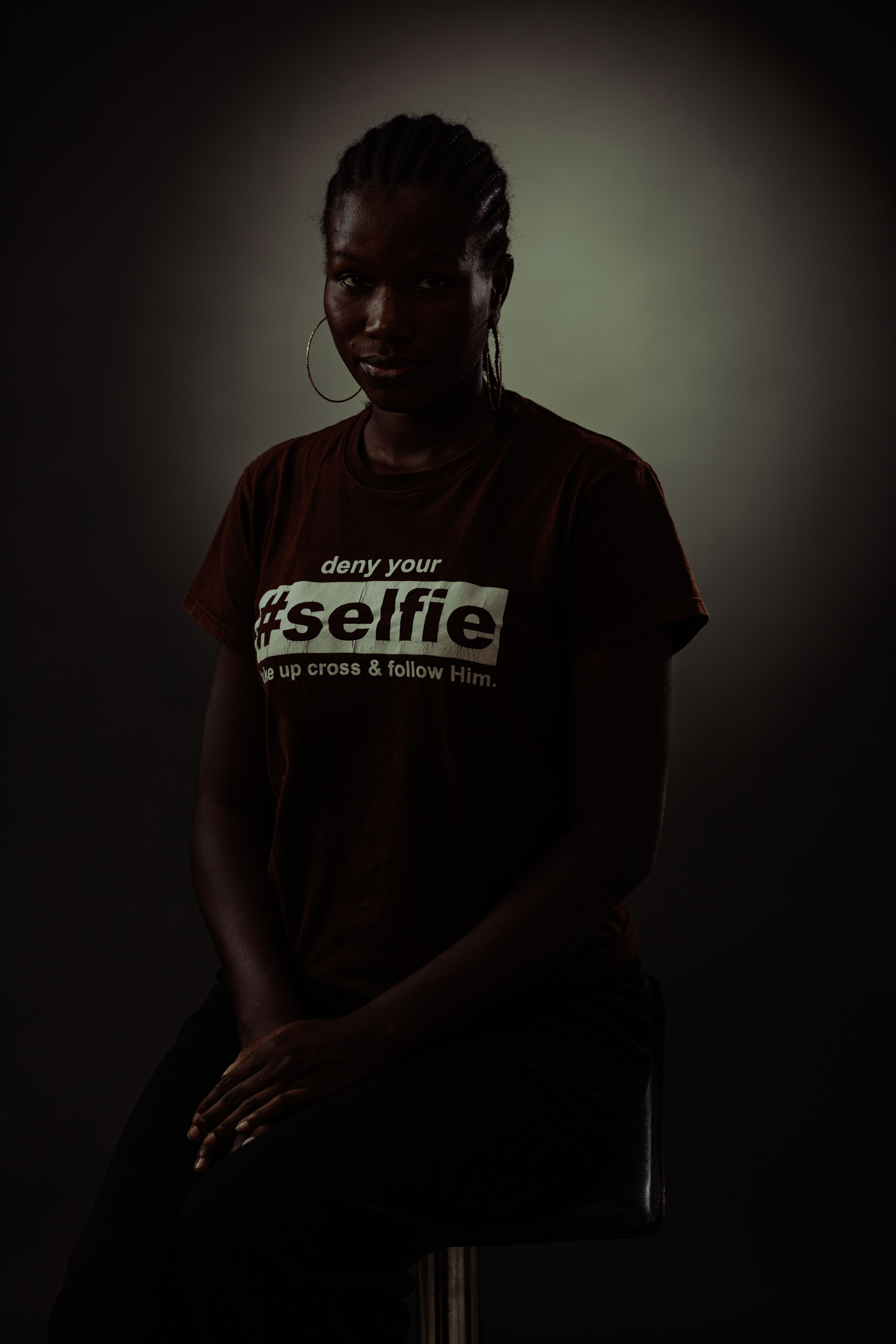 Young Woman Posing in Dark Studio · Free Stock Photo