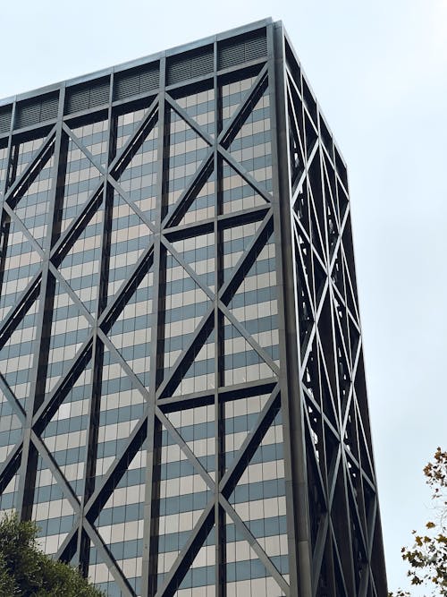 Modern Glass Building against Sky Background