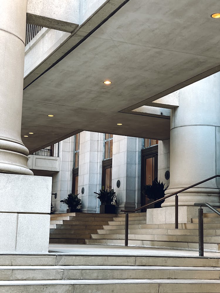 Stairs At Entrance To Stone Building With Columns 