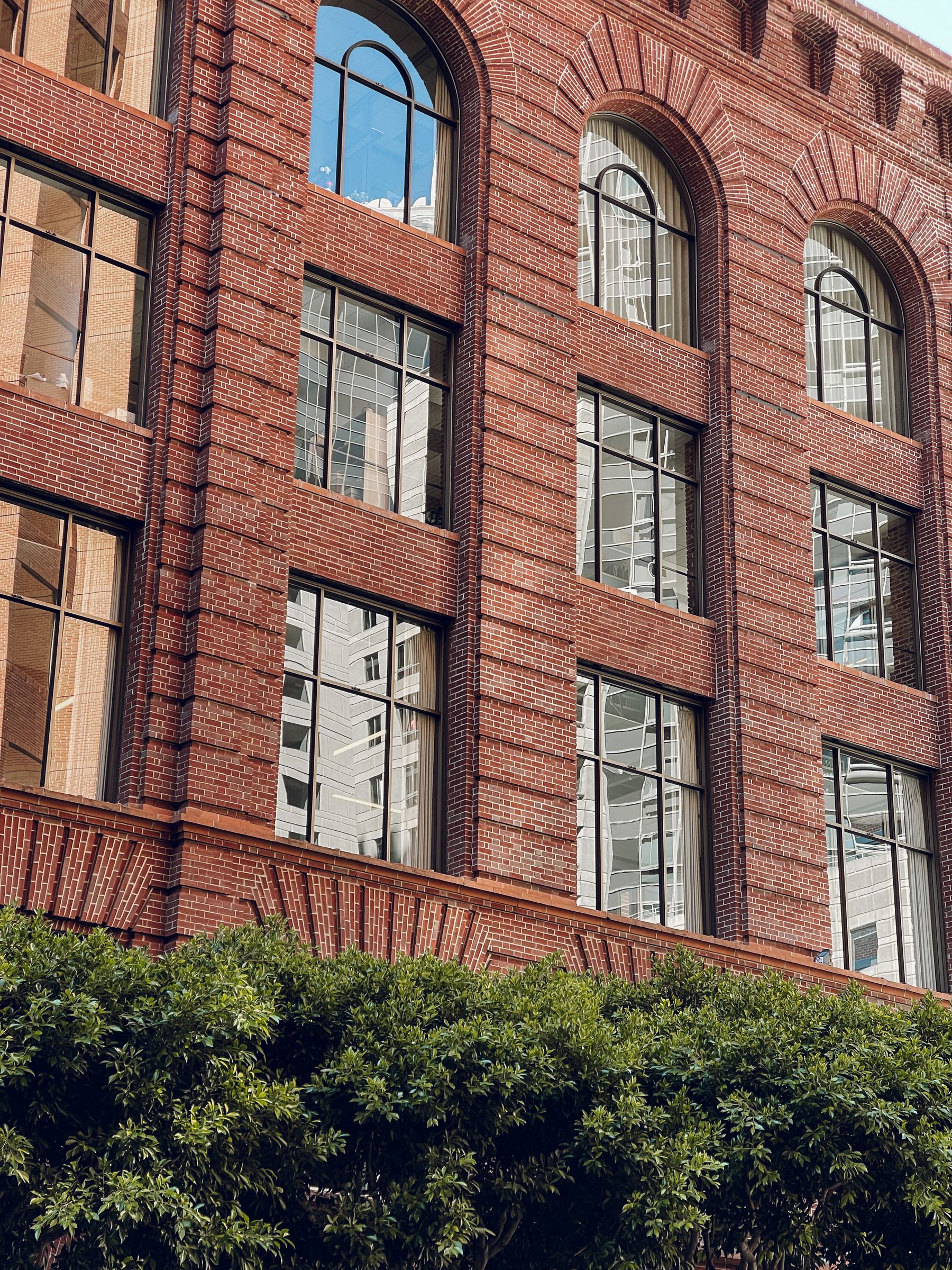 Historic Folgers Coffee Company brick building with arched windows in San Francisco.