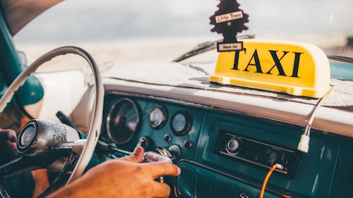 Free Person Driving Taxi Stock Photo