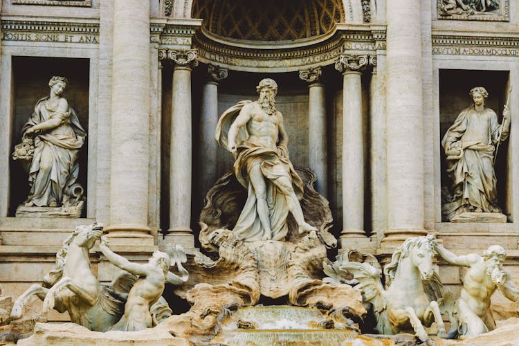 Antique Fountain On A Square In Rome