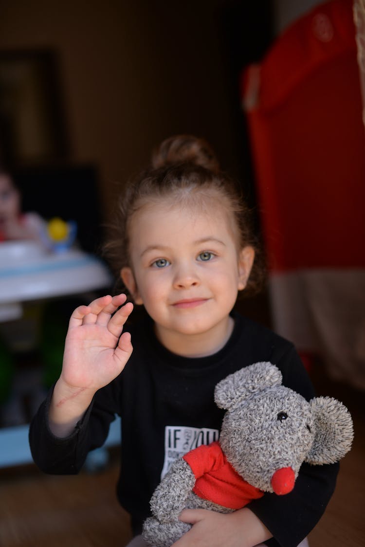 Girl Waving By Hand