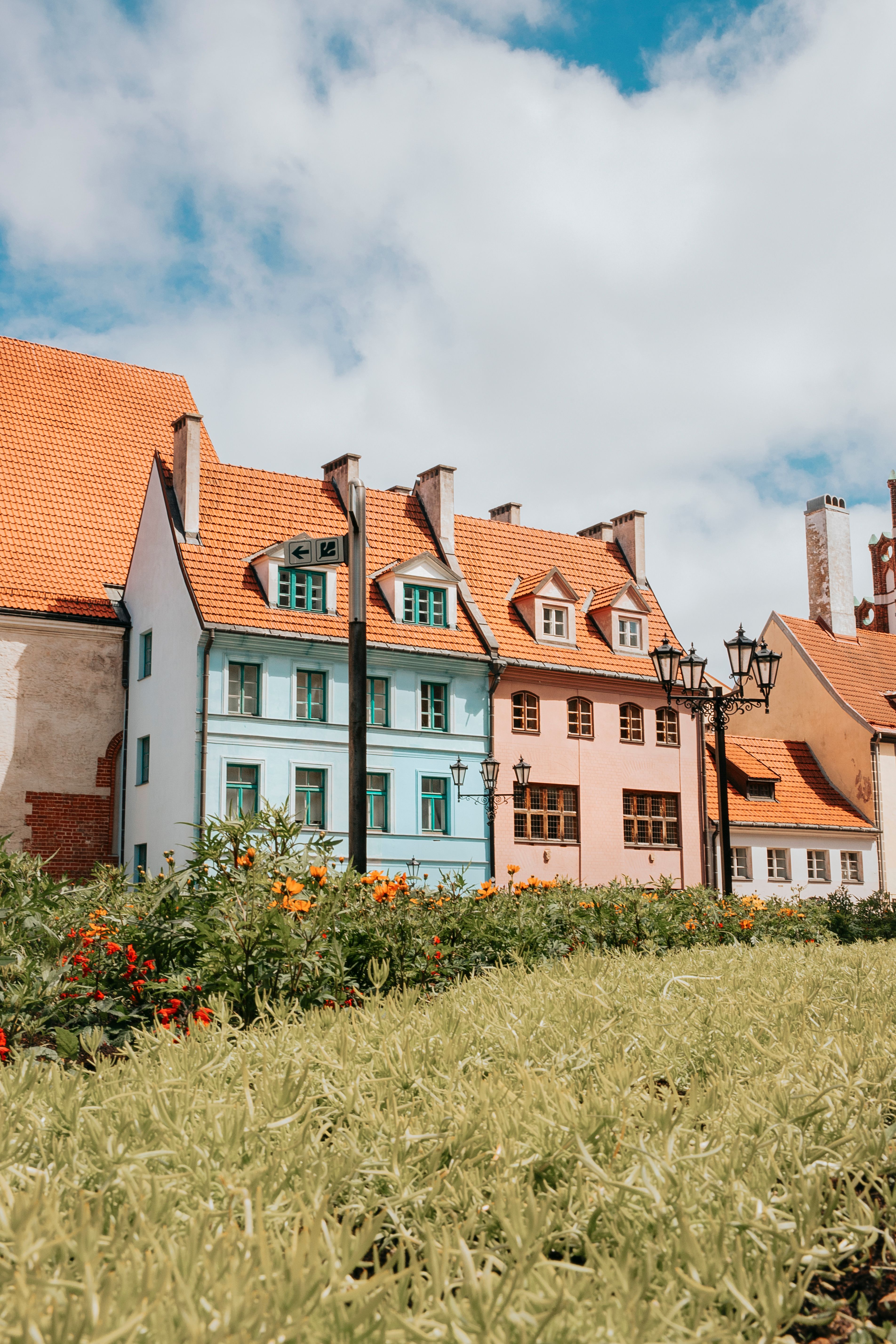 Multi Colored Houses and Saint George Church in Riga · Free Stock Photo