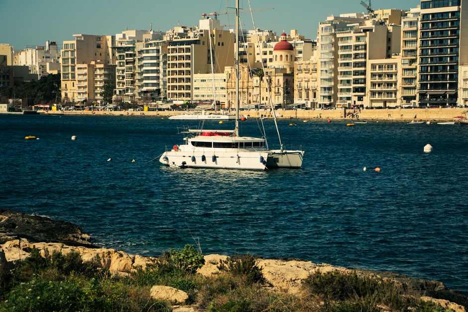 Incredible RYA Practical Sail Cruising Course in Malta for 5 Days (Sleep Onboard Included) Review 2026 - A luxurious yacht anchored on Valletta's beautiful waterfront, showcasing the vibrant cityscape.