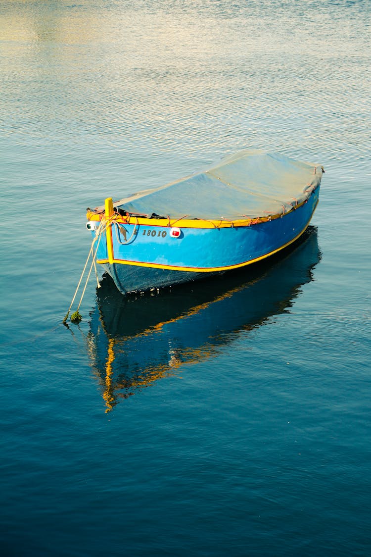 Boat With Cover On Lake