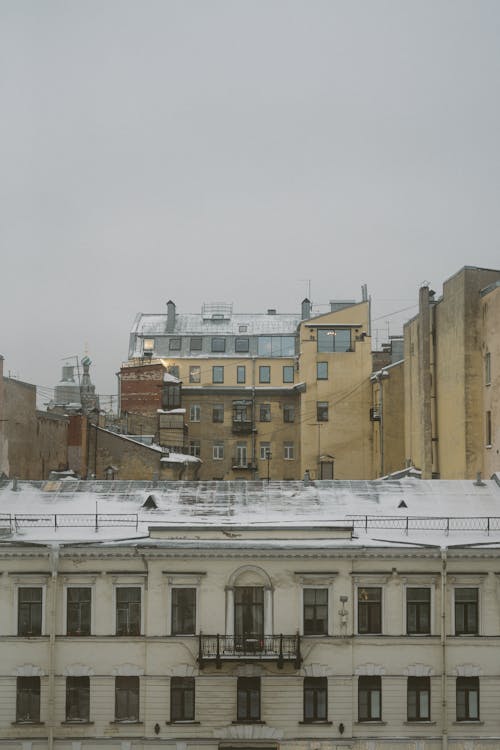 Snow on Urban Roofs
