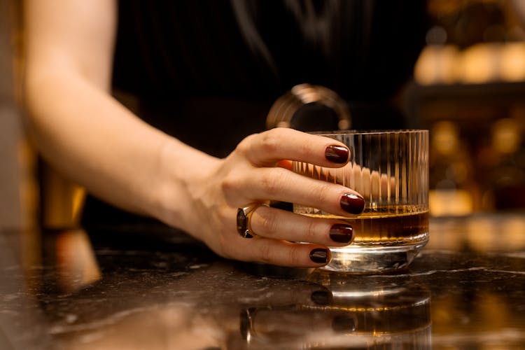 Woman Hand On Drink Glass