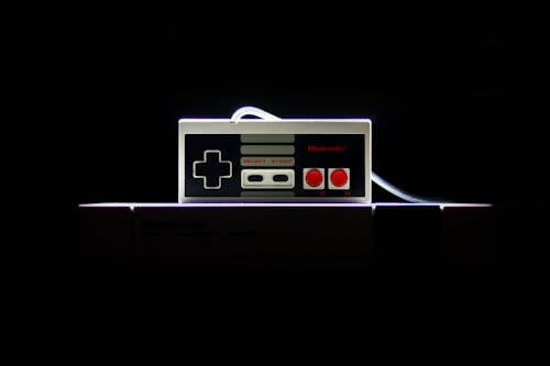 Low-light Photo Of Nes Controller