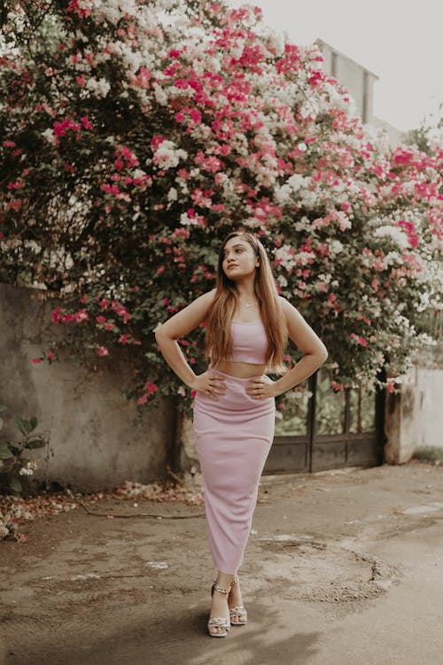 Beautiful Woman in a Pink Top and Skirt 