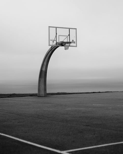 Basketball Hoop Standing against a Foggy Coast