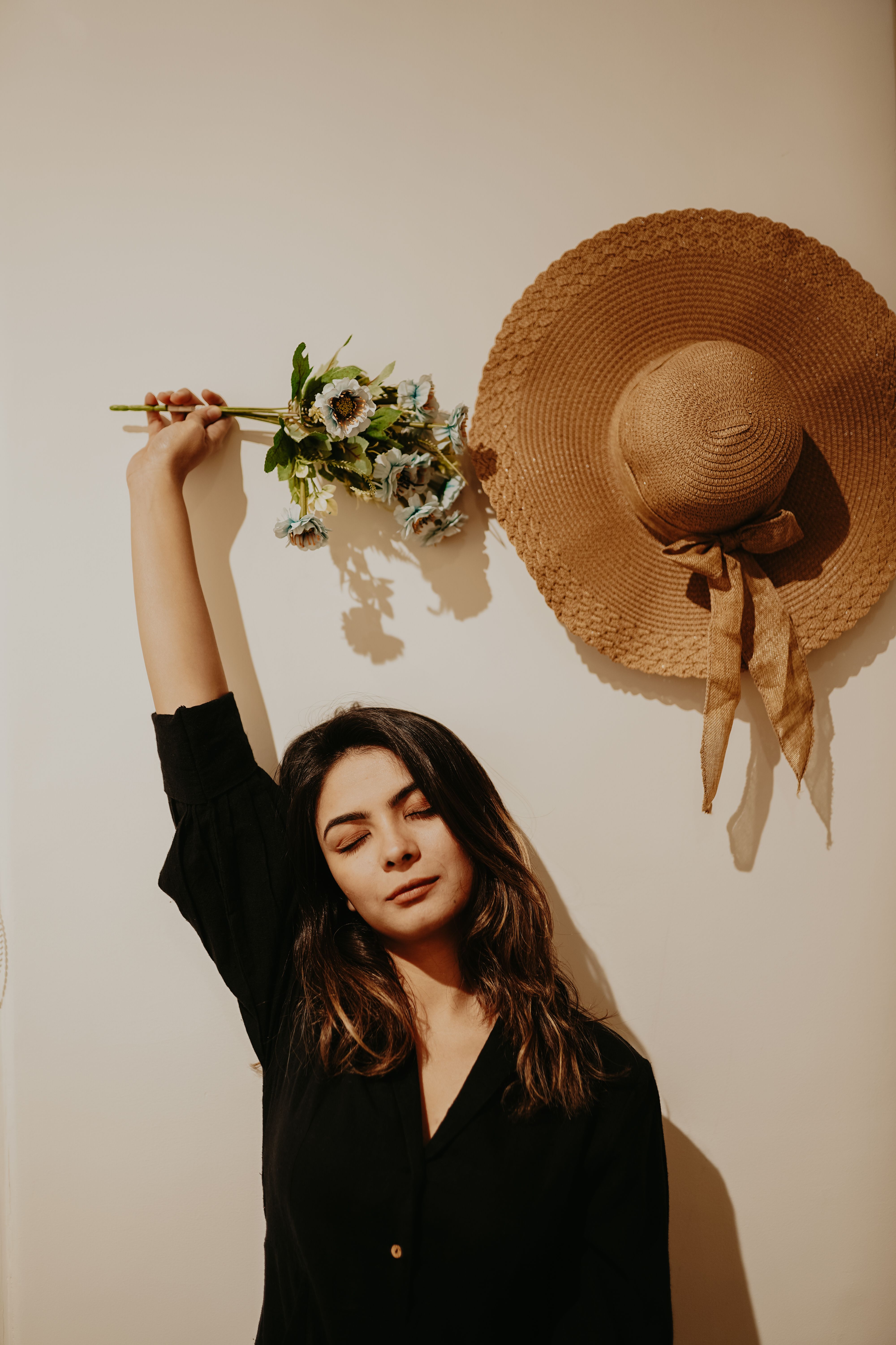 Brunette Woman with Straw Hat and Flowers · Free Stock Photo