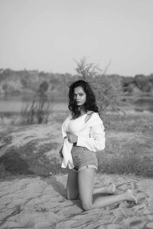 Portrait of a Woman Kneeling on the Beach