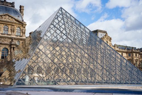 Free Iconic glass pyramid of the Louvre Museum in Paris, France. Stock Photo