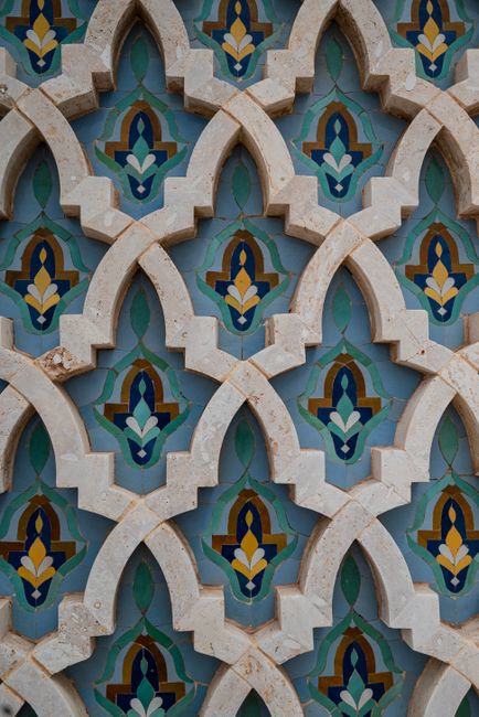 Close-up of ornate Islamic geometric patterns at Hassan II Mosque in Casablanca, Morocco.